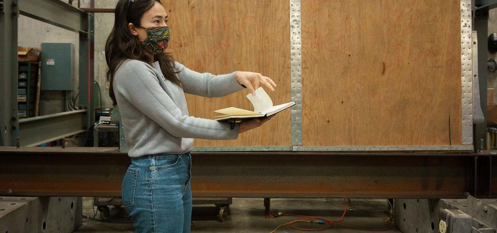 Elizabeth Claypool talking through her notes in the High Bay Laboratory.