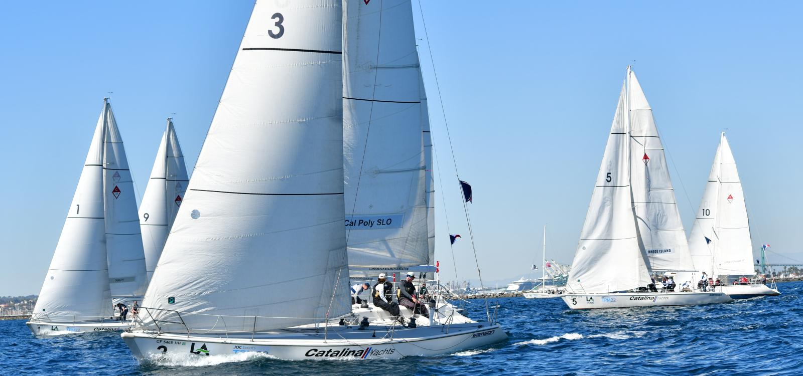 Cal Poly Sailing Club's boat pictured alongside boats from other universities during one of the races for the Los Angeles Harbor Cup.