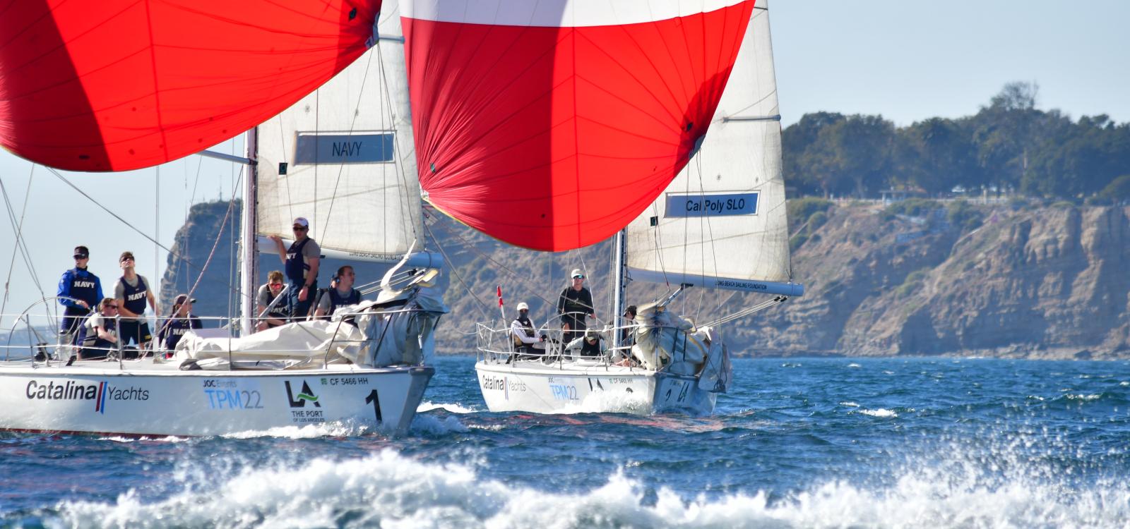 The Cal Poly Sailing Club sails near the U.S. Naval Academy's boat during a race for the Los Angeles Harbor Cup.
