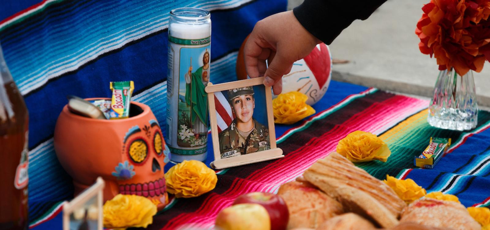 An ofrenda featuring the iconic colorful skulls and sweet pan de muerto, or bread of the dead