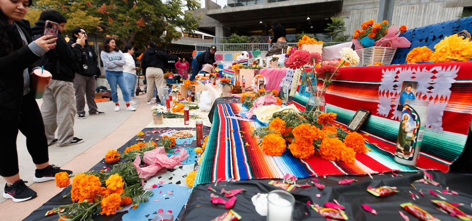 Students gathered throughout the day to view the ofrendas and pay their respects to the loved ones being honored.