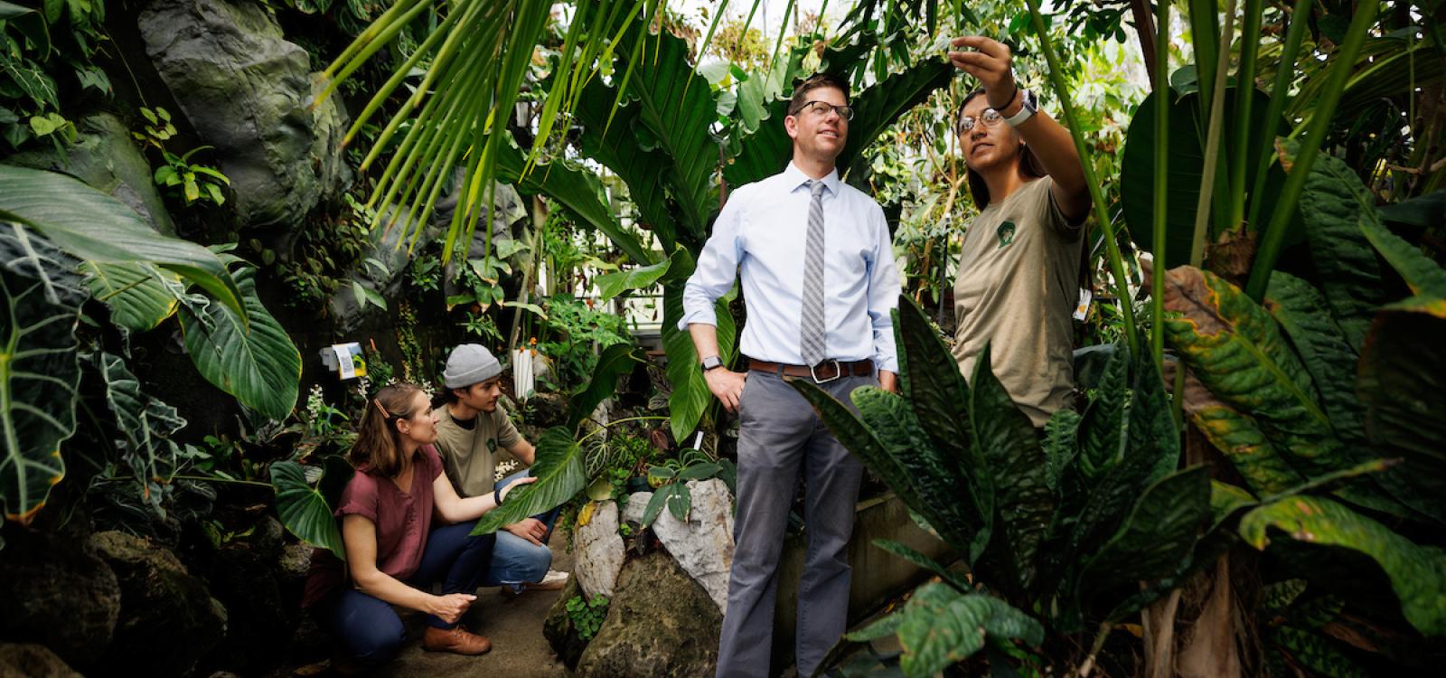 Professors Jenn Yost and Matt Ritter, along with students Jack McLure and Monique Alvarez, in the tropical greenhouse.