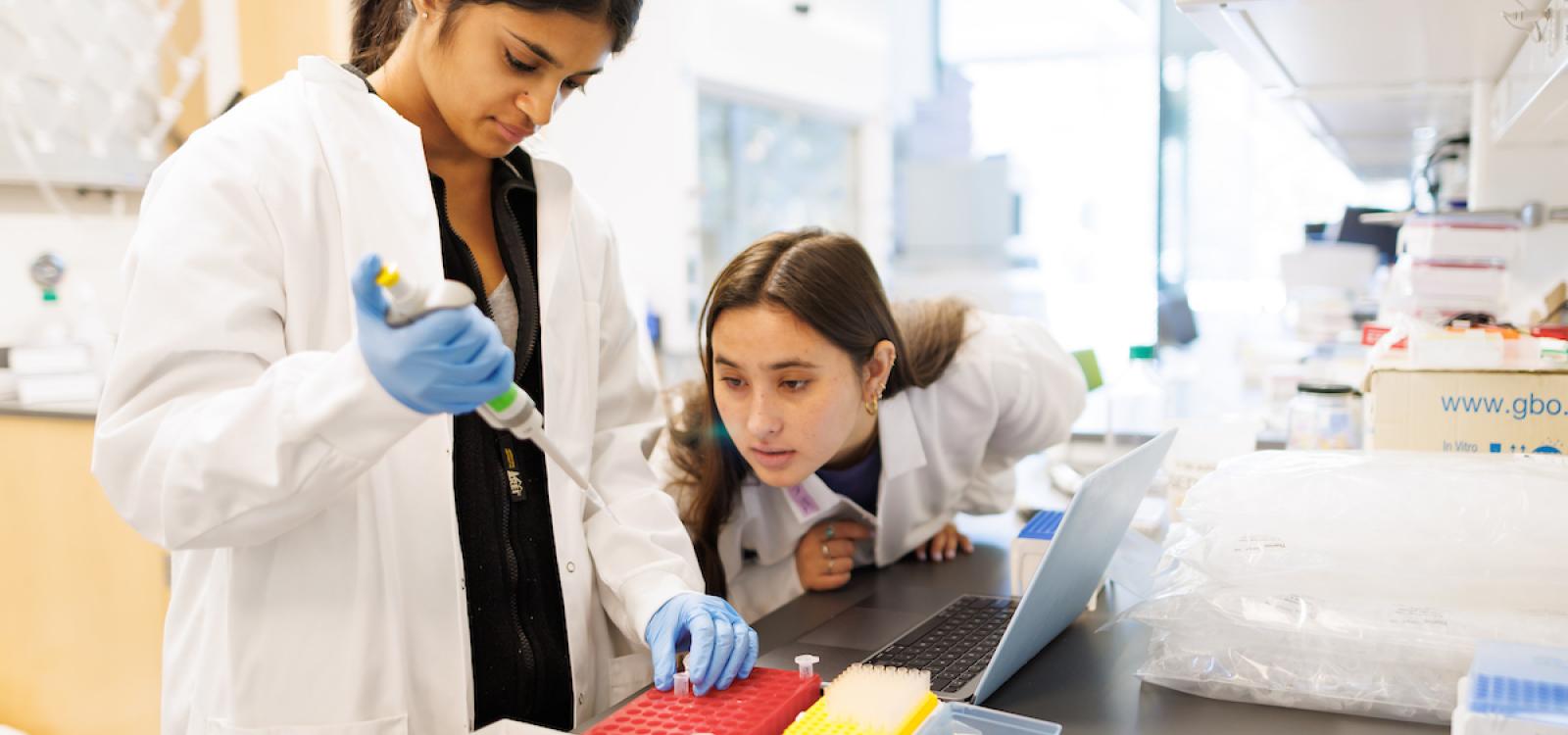 Students working with professor Nathaniel Martinez conduct research in the Applications in Biotechnology lab inside the new Frost Center.