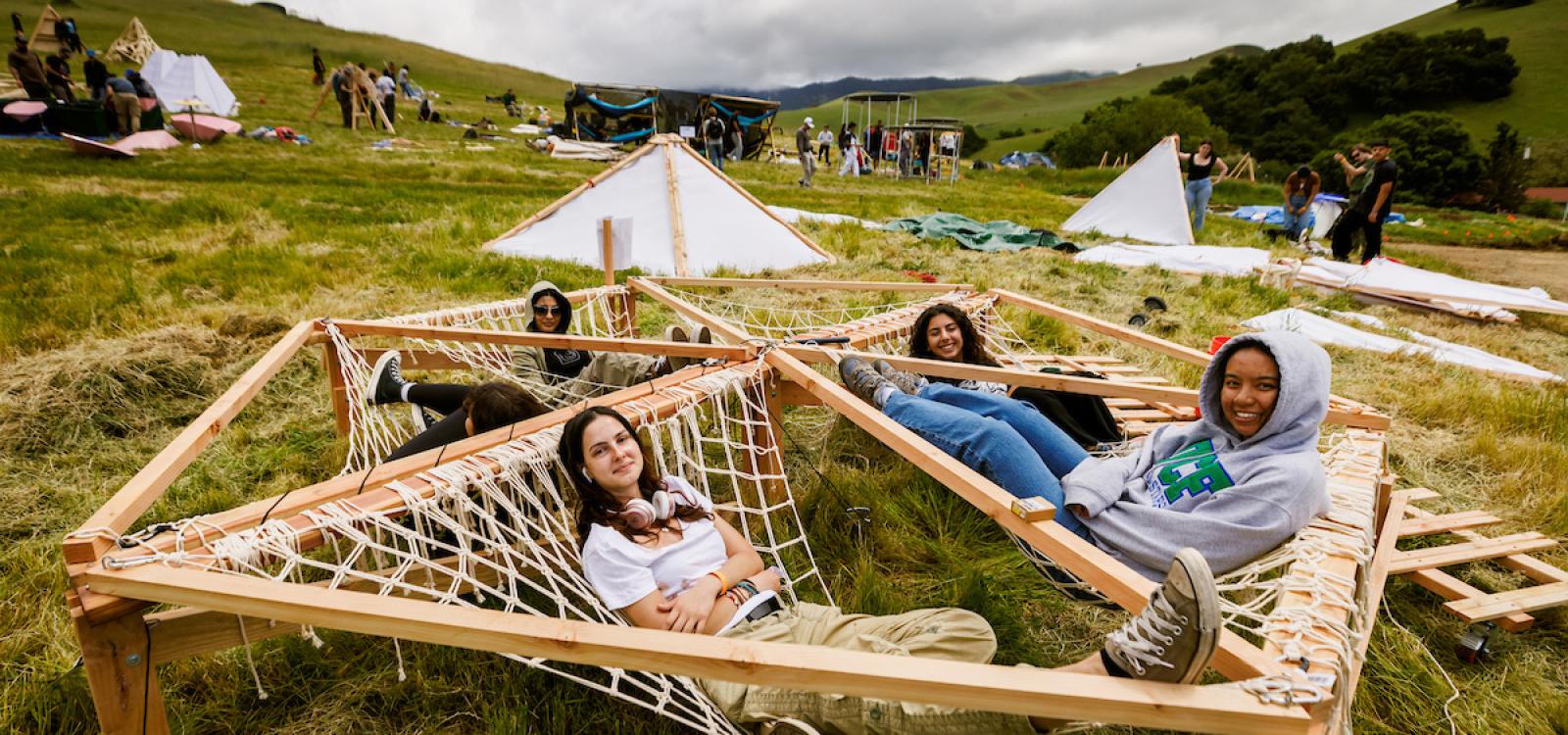 Students lounge in a structure they created as part of Design Village.