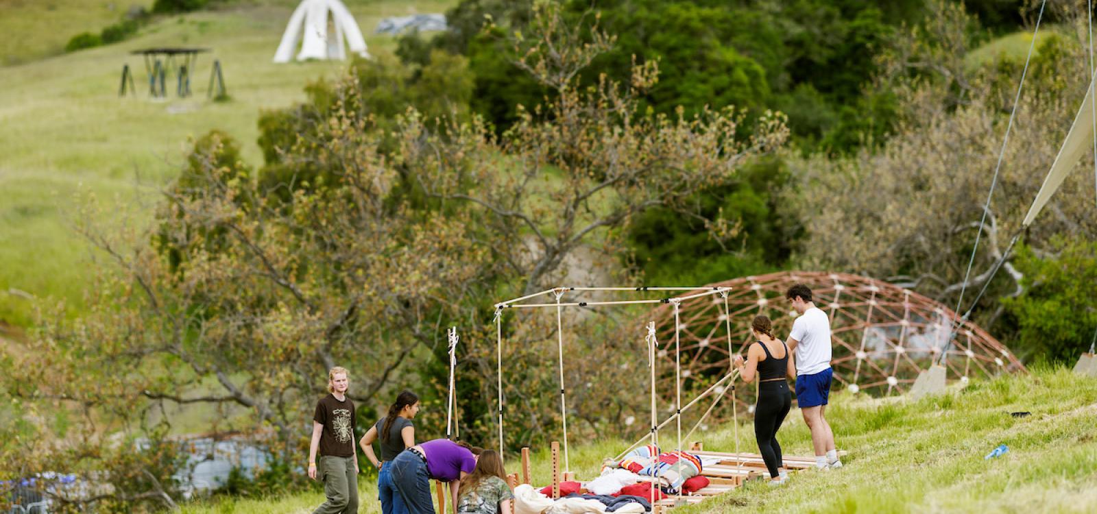 Students work on their structures in Poly Canyon during Design Village.