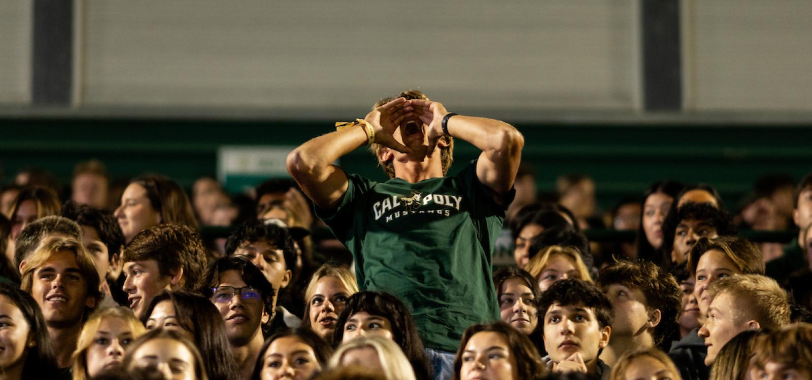 A student cheers at the Big Fall Welcome on the first night of WOW.