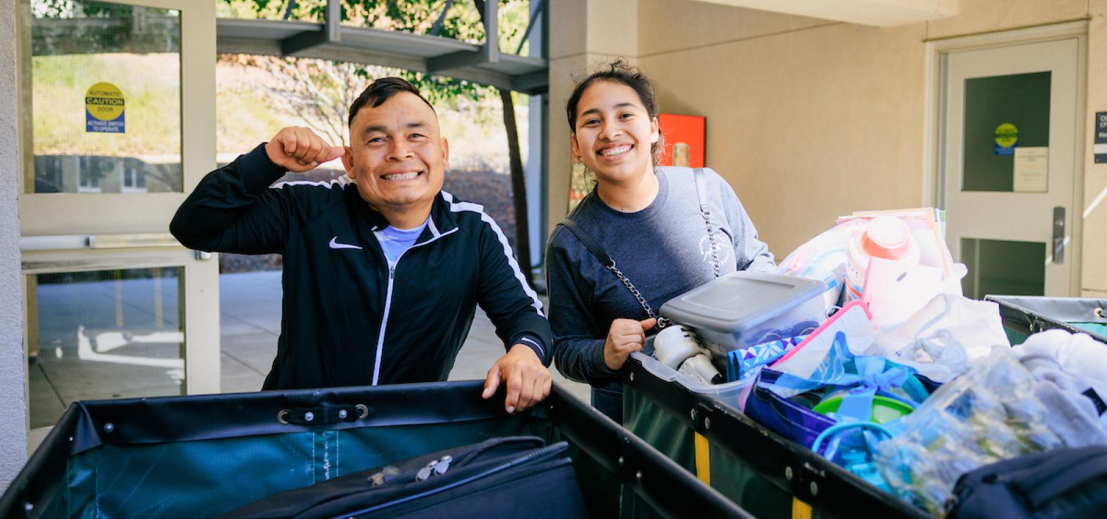 A student and parent pose for the camera during the Fall Mustang Move-In.