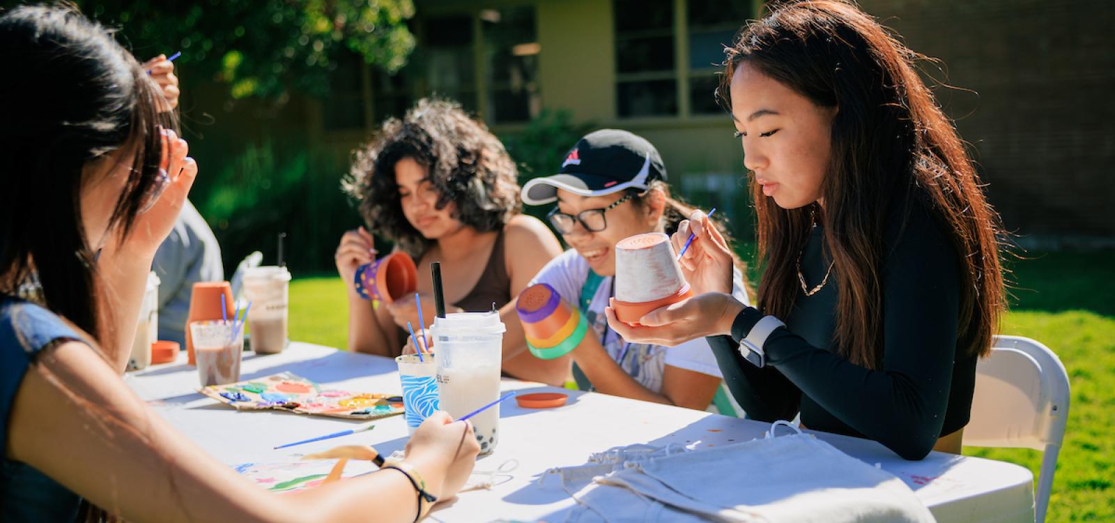 Students participating in Week of Welcome do arts and crafts on Baker Lawn.