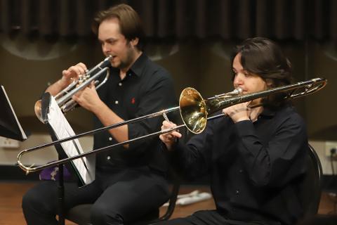 A group of students playing brass instruments