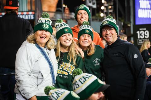 Alumni dressed in Cal Poly gear at a San Francisco Giants baseball game.