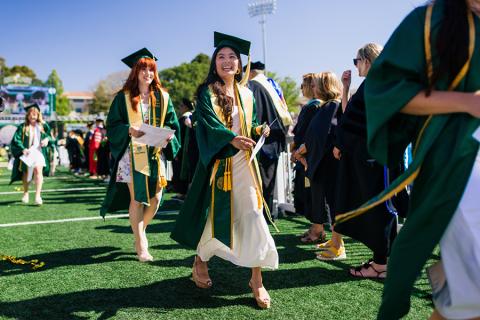 Graduating students walking at Cal Poly Commencement.