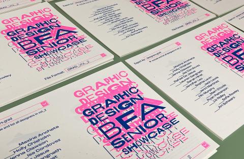 Posters advertising the exhibition “File format.grad” on a table.