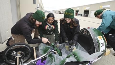 Students work on the Cal Poly Supermileage vehicle.