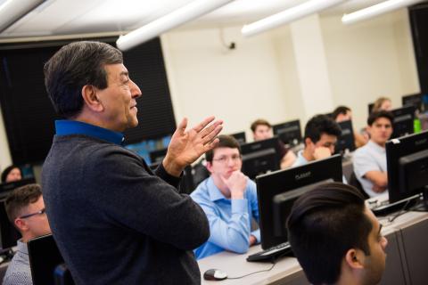 Cyrus Ramezani leads a class.