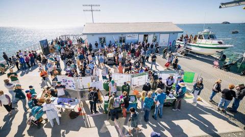 People attending a past Open House at the Cal Poly Pier.