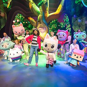 Gabby on stage with the characters.