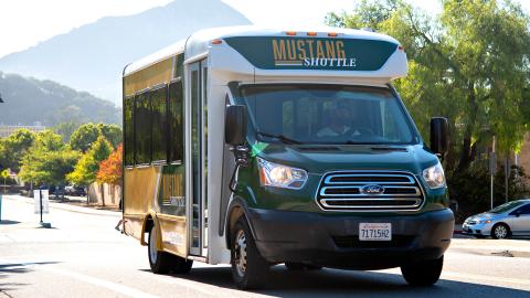 The Mustang Shuttle being driven on campus.
