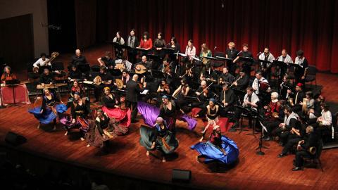 The Cal Poly Arab Music Ensemble performing on stage. 