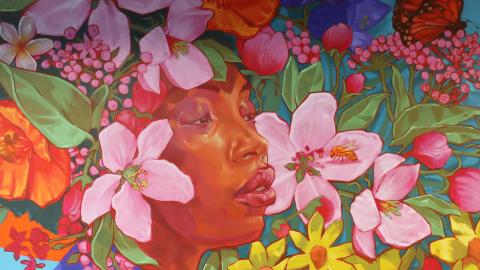 The Grounds for Growth mural showing a woman surrounded by flowers. 