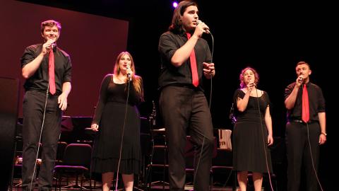 The Vocal Jazz Ensemble performing on stage.
