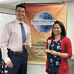 Cal Poly Toastmasters members Jared Mandrell and Stacey Aragon holding their trophies at Toastmasters International. 