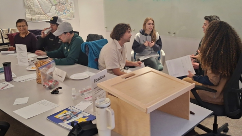 Cal Poly Toastmasters members discussing the club.