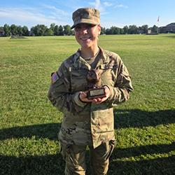 Cadet Gigi Travagline receiving an award for highest fitness score.