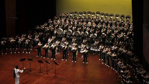 Mustang Marching Band performing on stage.