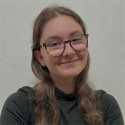 A headshot of Audrey Klein in a dark-colored blouse.