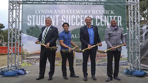 Four men holding shovels of dirt in front of a groundbreaking sign. From left to right: President Jeffrey D. Armstrong; agricultural business student Anthony Barboza; Andy Anzaldo (Agricultural Business '98); and Vice President Terrance Harris.