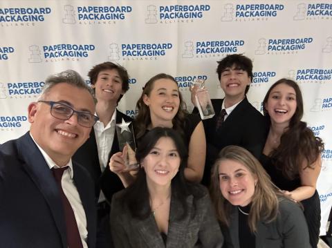 Members of team “PAWSH” pose with their awards