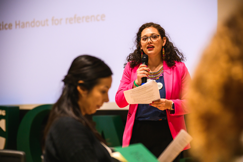 Facilitator Diana Ortiz Giron presenting to staff and faculty.