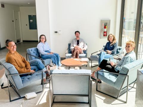An image of a group of faculty and staff sitting around a table at a Campus Dining focus group.