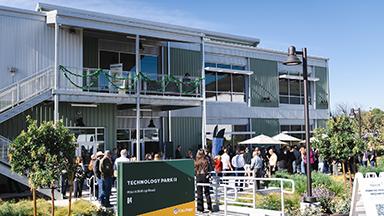 People gathered at the ribbon-cutting ceremony for the new Cal Poly Technology Park 2 building. 