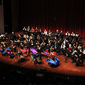 The Cal Poly Arab Music Ensemble performing on stage.