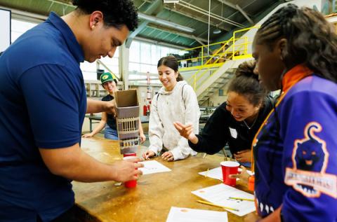 High school students participate in a hands-on activity during Cal Poly’s United by Excellence: Black Joy Celebration.