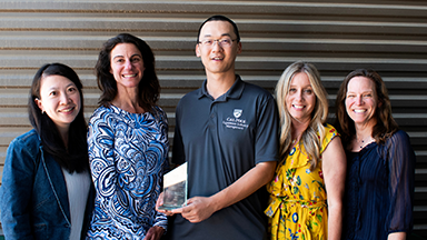 Winners of the 2025 President’s Diversity Award from the Experience Industry Management Department posing with their award.