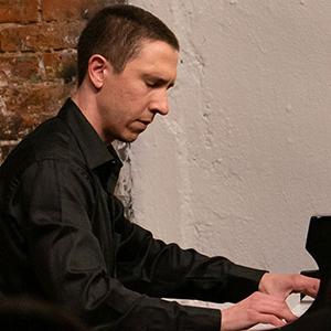 Nic Gerpe playing the piano.