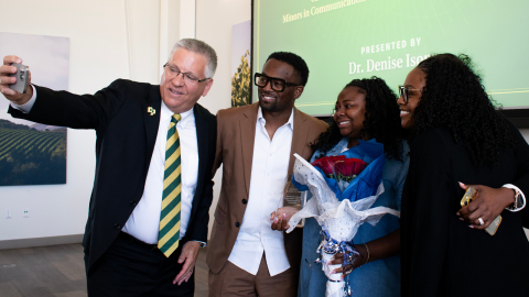2025 Student Award Winner, Nailah DuBose, pictured taking a selfie with President Armstrong and her parents.