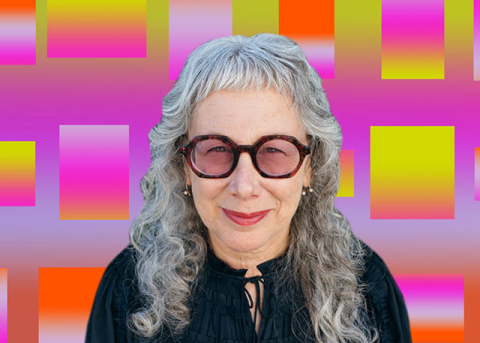 A headshot of Louise Sandhaus with a colorful, geometric background.