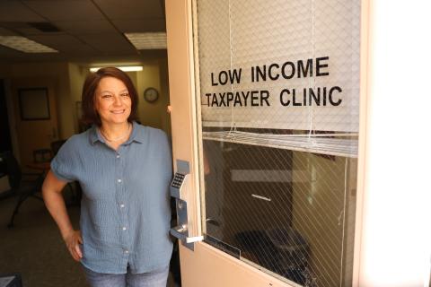 An LITC staff member at the clinic’s front door.