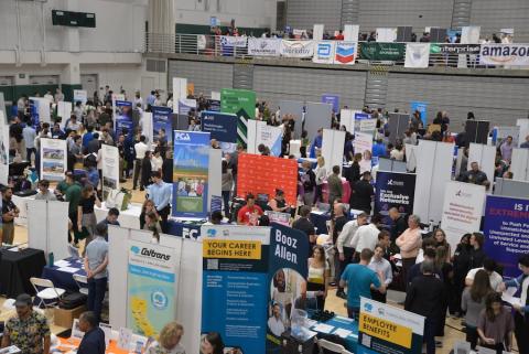 Students attending a career fair in Mott Gym on the San Luis Obispo campus.