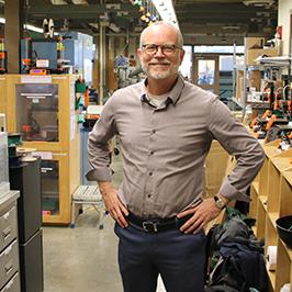 Bob Crockett standing in a lab.