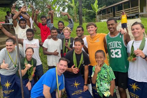 Leaders and crew members of the Summer Sea Term pose with residents of Vuisiga Village in Fiji. 