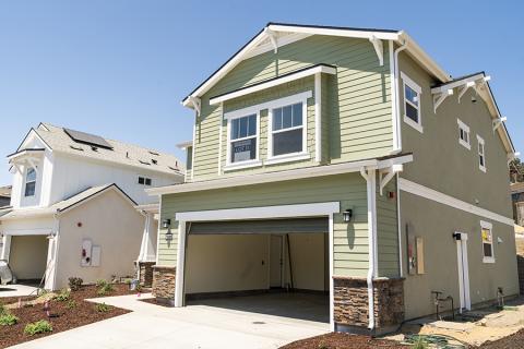 A home in the Vista Meadows development with its two-car garage door open.