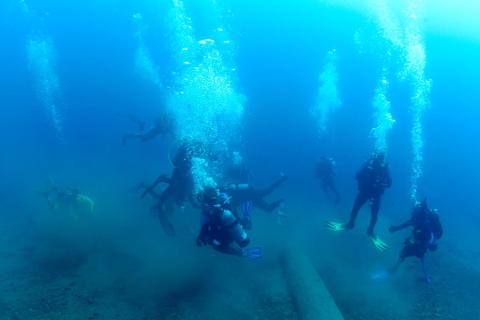SCUBA divers exploring the floor of Lake Tahoe.