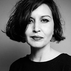 A black-and-white headshot of Layli Long Soldier.