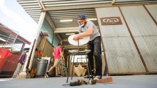 Cal Poly architecture student uses support lab concrete slab to work on design-build project. 