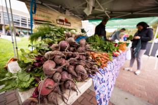 A pile of beets at a farmer's market stand on the Cal Poly campus.