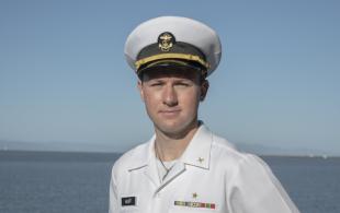 A student wearing a white maritime uniform.